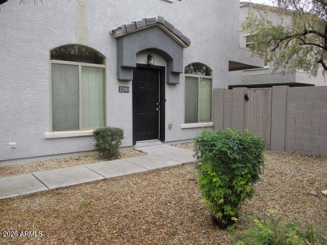 2150 West Alameda Road, Unit 1290 Phoenix, AZ 85085 - Photo 2 of 9 a front view of a house with garden