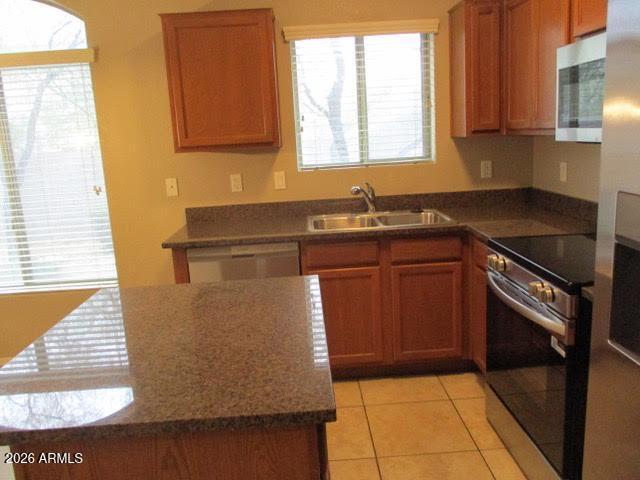 2150 West Alameda Road, Unit 1290 Phoenix, AZ 85085 - Photo 3 of 9 a kitchen with a sink cabinets and window