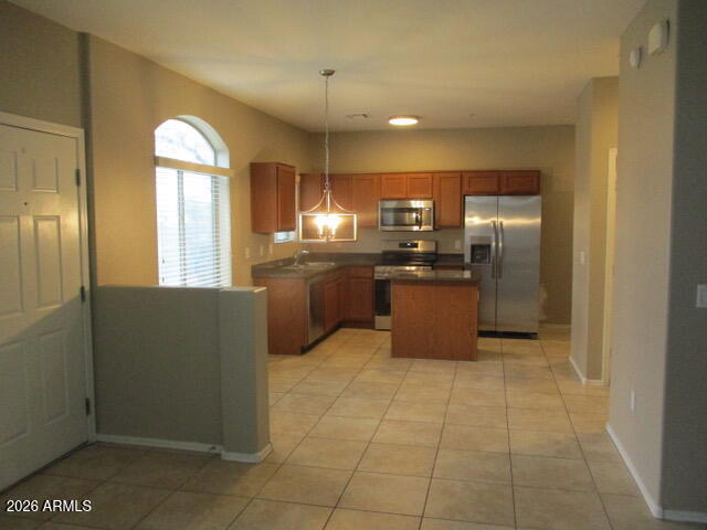 2150 West Alameda Road, Unit 1290 Phoenix, AZ 85085 - Photo 4 of 9 a kitchen with stainless steel appliances granite countertop a refrigerator and a sink