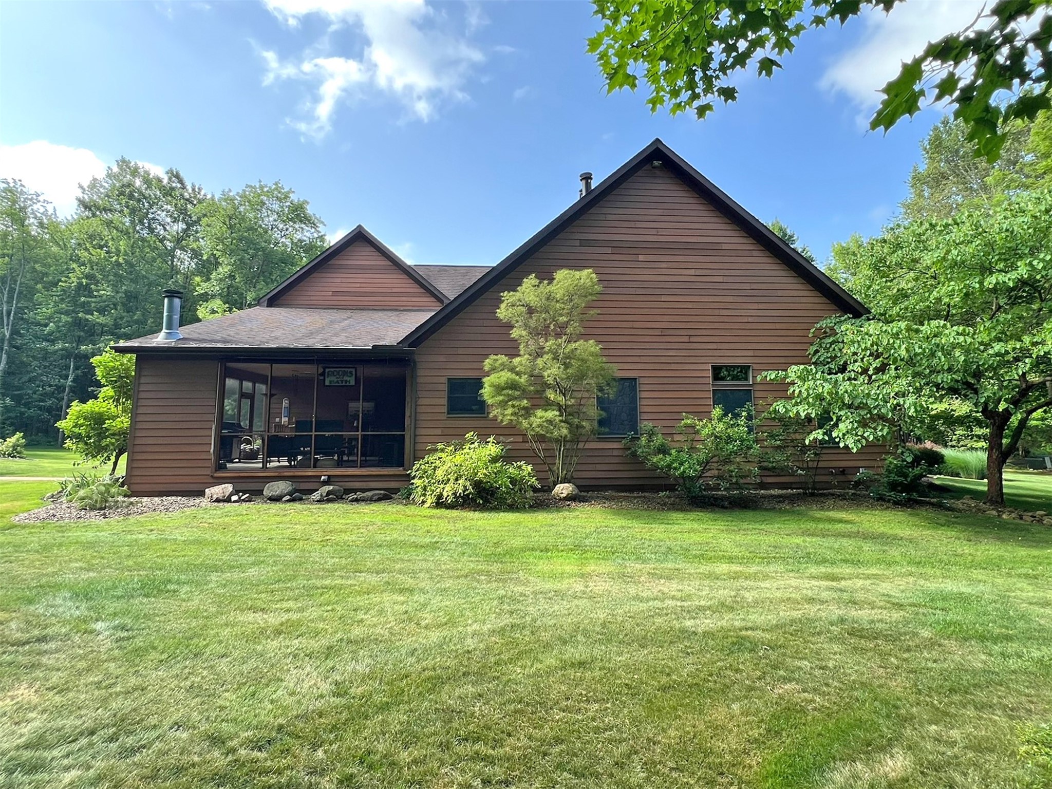 6901 Franklin Road Fairview, PA 16415 - Photo 45 of 50 Left Side By Fire Pit: View Of Screened Patio, Kitchen & Living Room