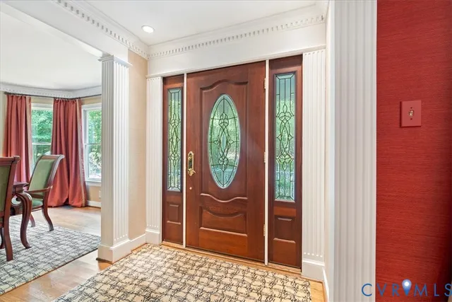 a en suite bathroom with a granite countertop sink and a mirror