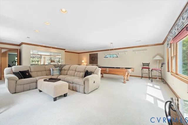 a view of a house with swimming pool and sitting area