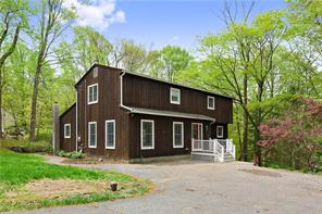 4 Tamarack Road Lincolndale, NY 10541 - Photo 1 of 1 front view of a house with a garden