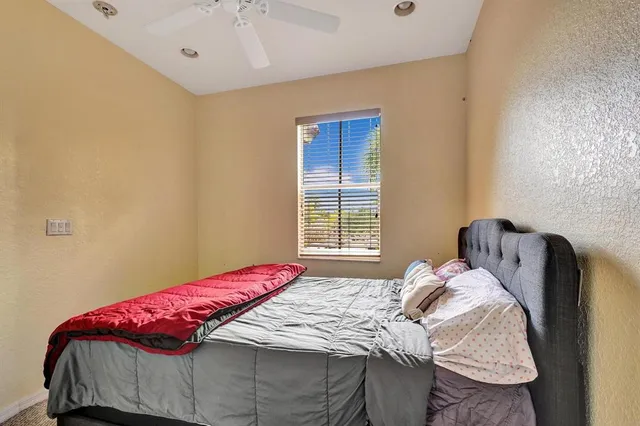 a room with a dresser and a window