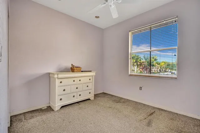 a bathroom with a sink a toilet a mirror and shower curtain