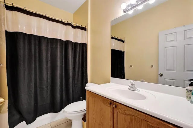 a bedroom with bed and a window