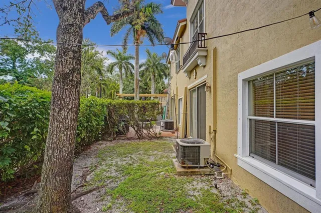 a front view of a house with outdoor seating