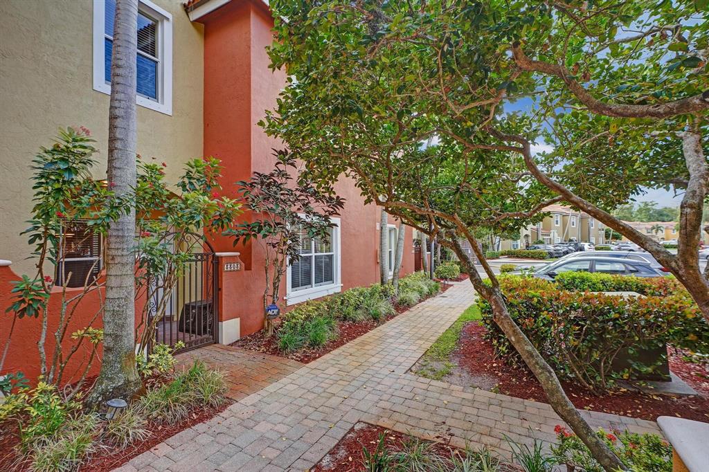 3303 Merrick Lane, Unit 1002 Margate, FL 33063 - Photo 28 of 33 a front view of a house with a yard