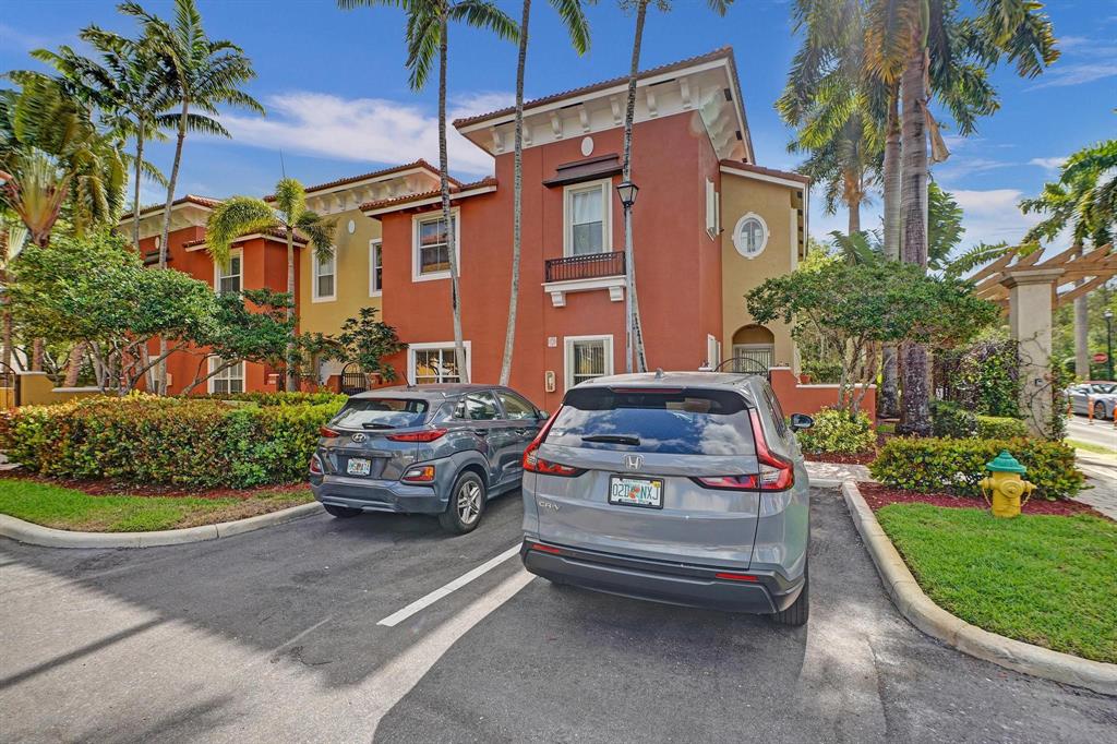 3303 Merrick Lane, Unit 1002 Margate, FL 33063 - Photo 29 of 33 a car parked in front of a house