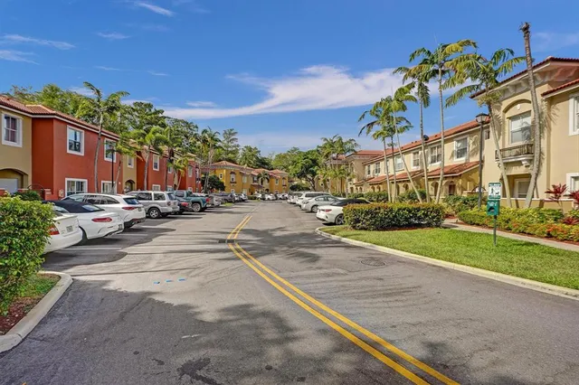 a front view of a house with swimming pool having outdoor seating