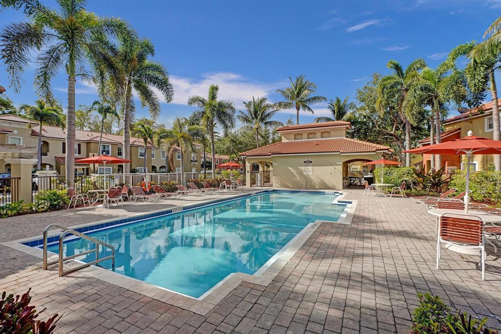 3303 Merrick Lane, Unit 1002 Margate, FL 33063 - Photo 32 of 33 a front view of a house with garden and swimming pool