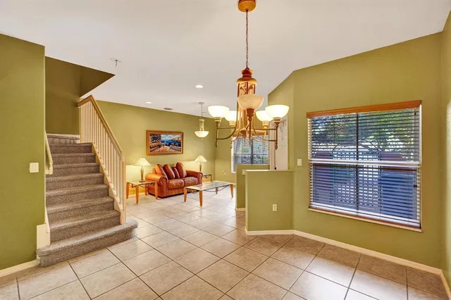 a view of an entryway and livingroom with furniture