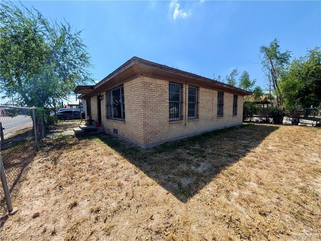 1015 Fresno Avenue McAllen, TX 78501 - Photo 11 of 14 a front view of a house with a yard