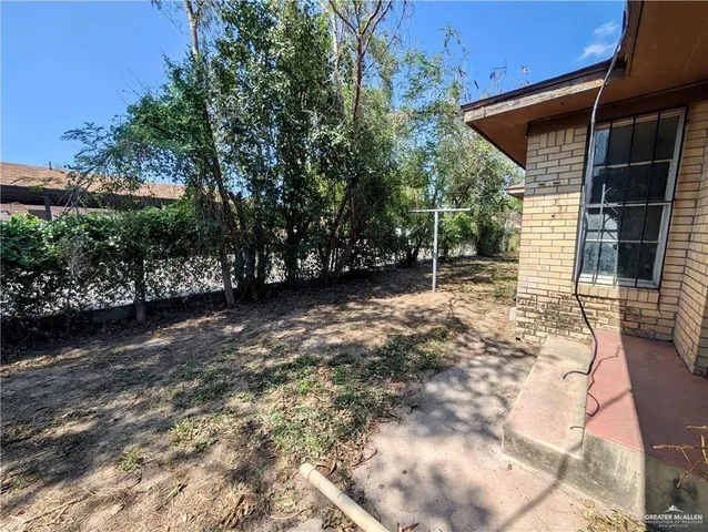 a backyard of a house with lots of green space