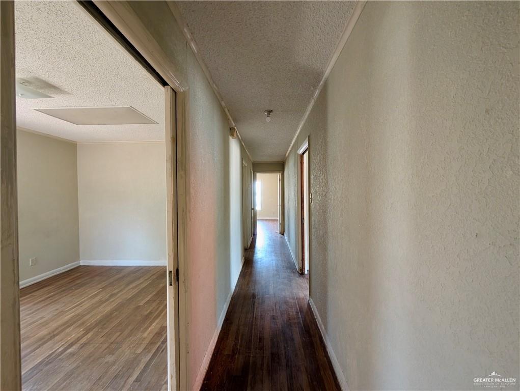1015 Fresno Avenue McAllen, TX 78501 - Photo 6 of 14 a view of a hallway with wooden floor
