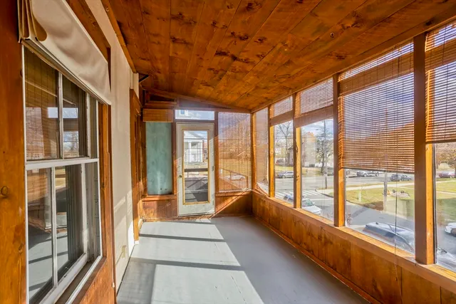 a view of a large room with windows