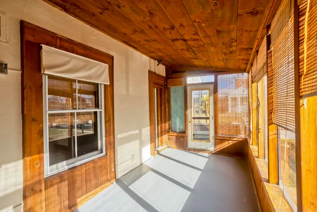 a view of a hallway with windows