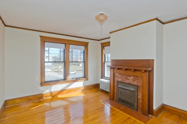 a bedroom with a bed and a fireplace