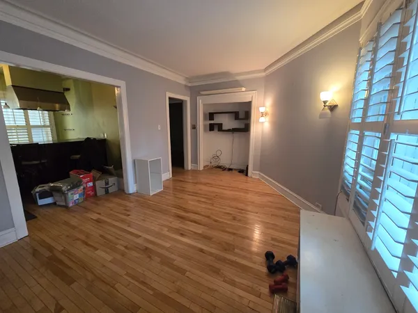 a bedroom with a bed and a tv