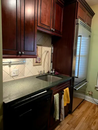 a kitchen with a sink and cabinets