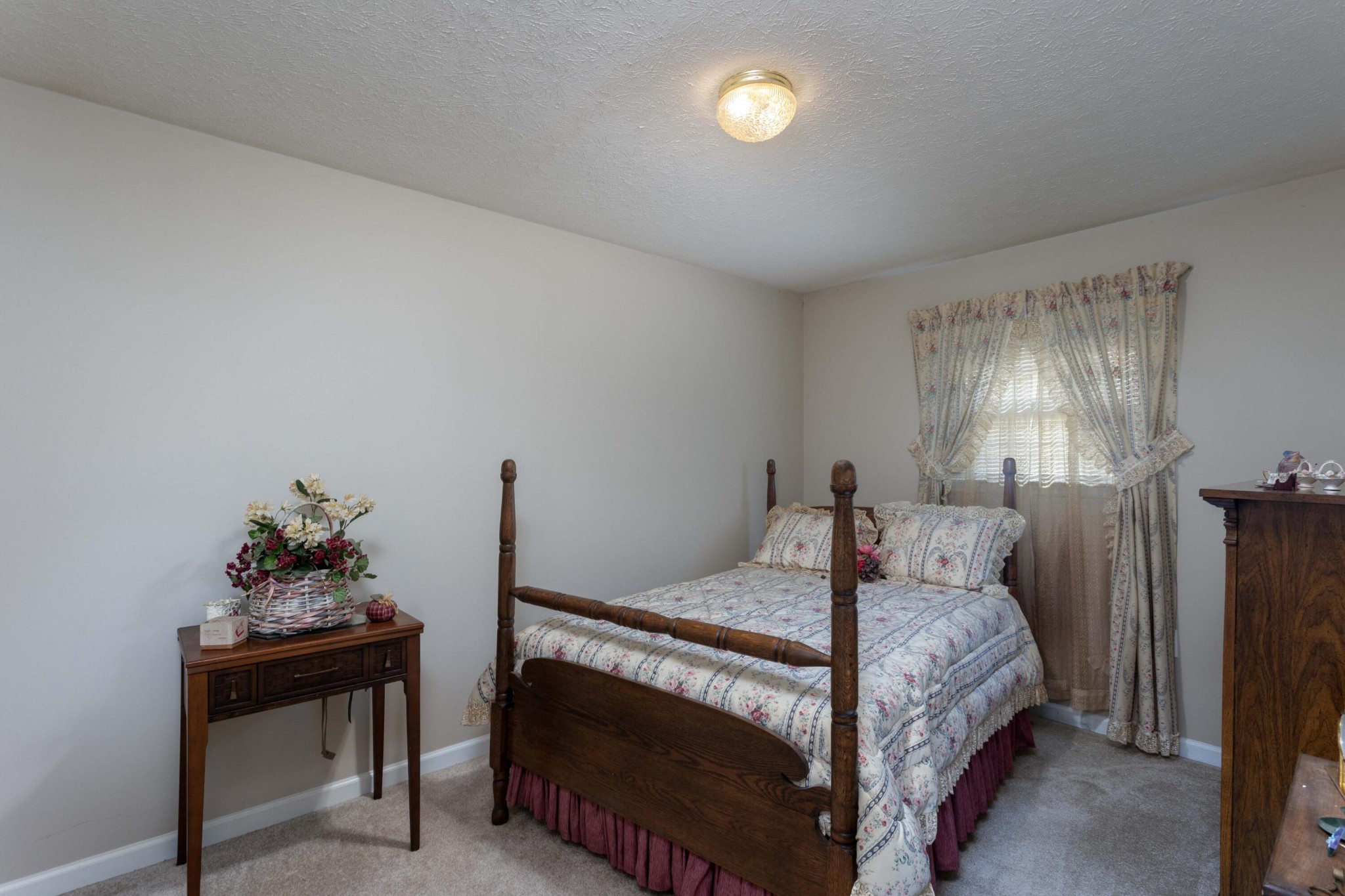 201 Broyles Road Spring City, TN 37381 - Photo 17 of 34 a bedroom with a bed and a potted plant