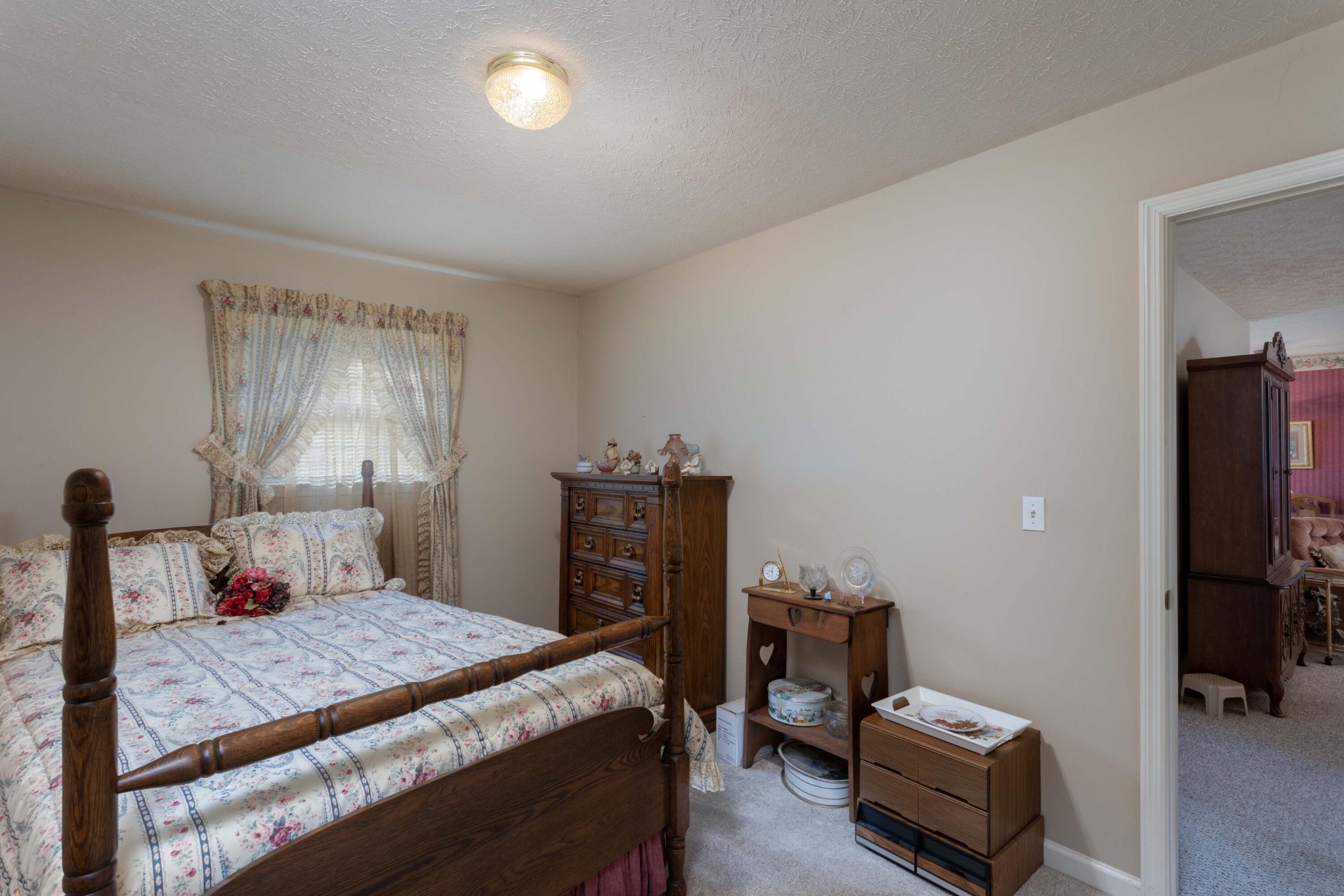 201 Broyles Road Spring City, TN 37381 - Photo 18 of 34 a bedroom with a bed and a tv on table