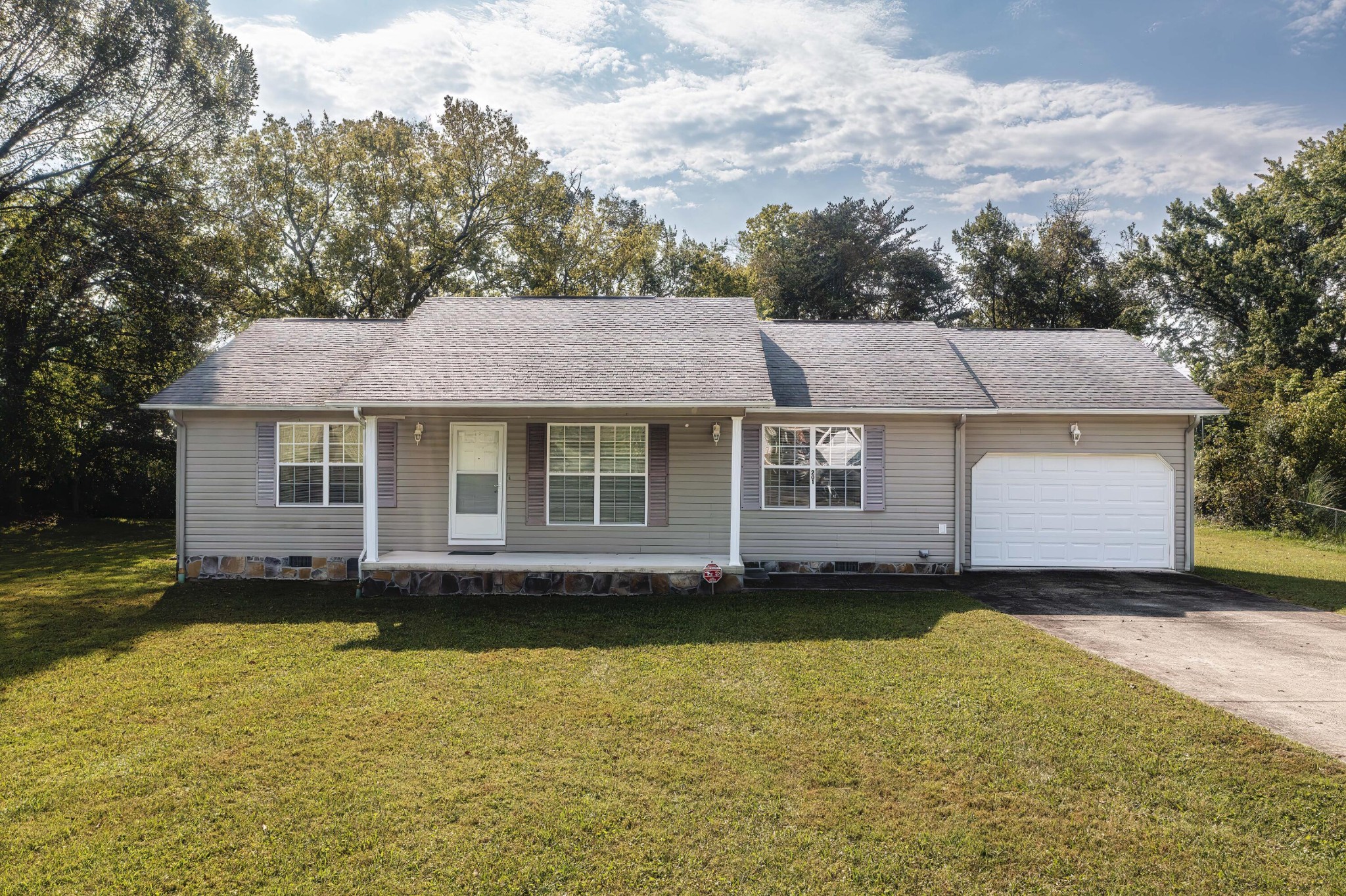 201 Broyles Road Spring City, TN 37381 - Photo 2 of 34 a front view of a house with a yard