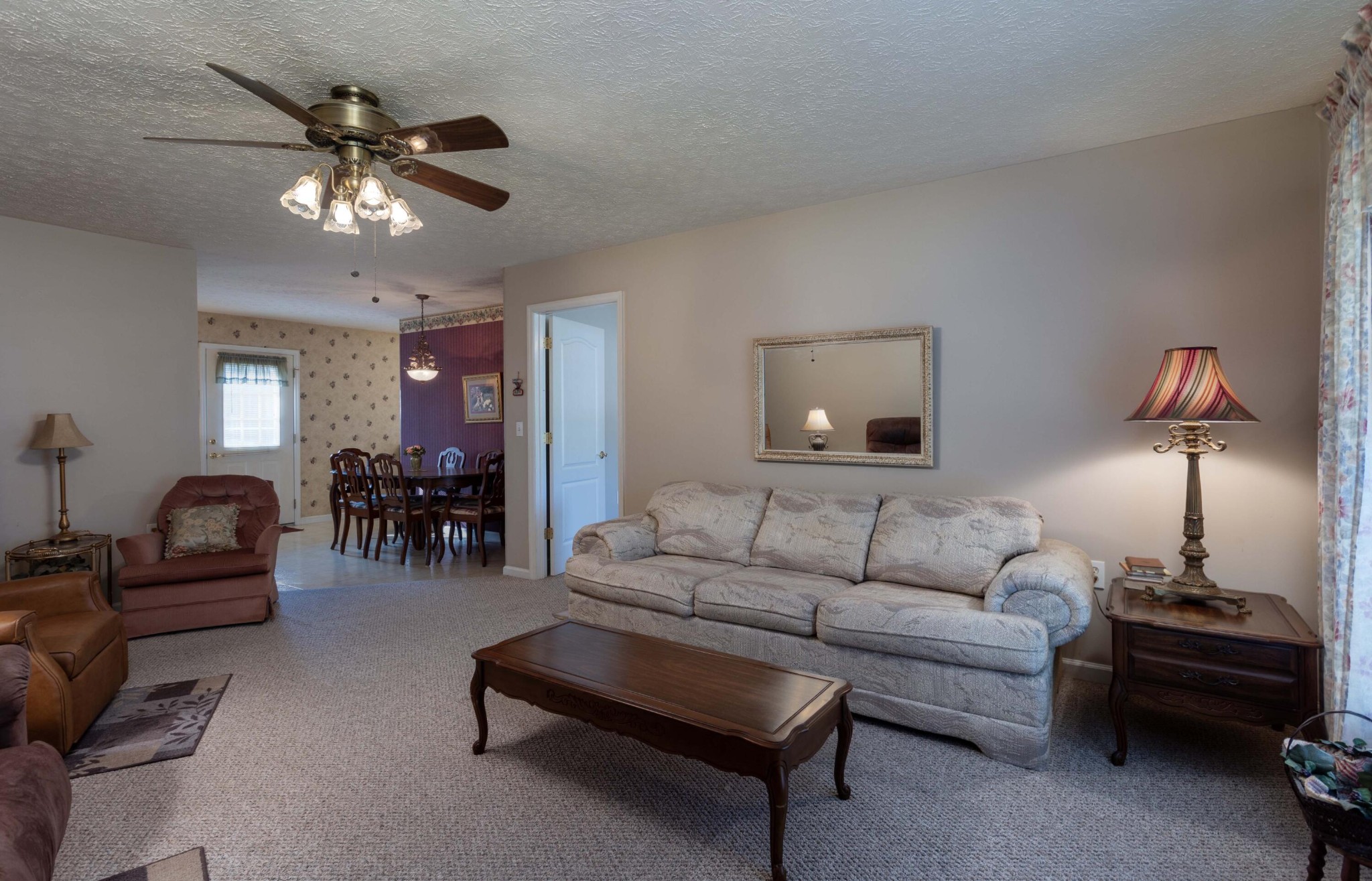 201 Broyles Road Spring City, TN 37381 - Photo 5 of 34 a living room with furniture and a chandelier