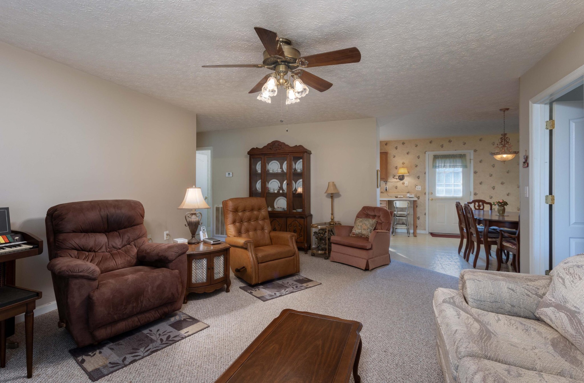 201 Broyles Road Spring City, TN 37381 - Photo 6 of 34 a living room with furniture and a chandelier