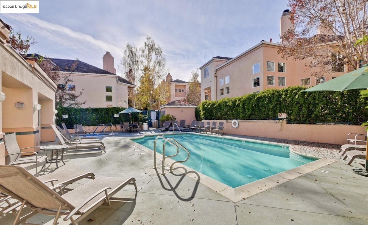 991 Asilomar Terrace, Unit 1 Sunnyvale, CA 94086 - Photo 19 of 20 Community pool with a patio and a residential view