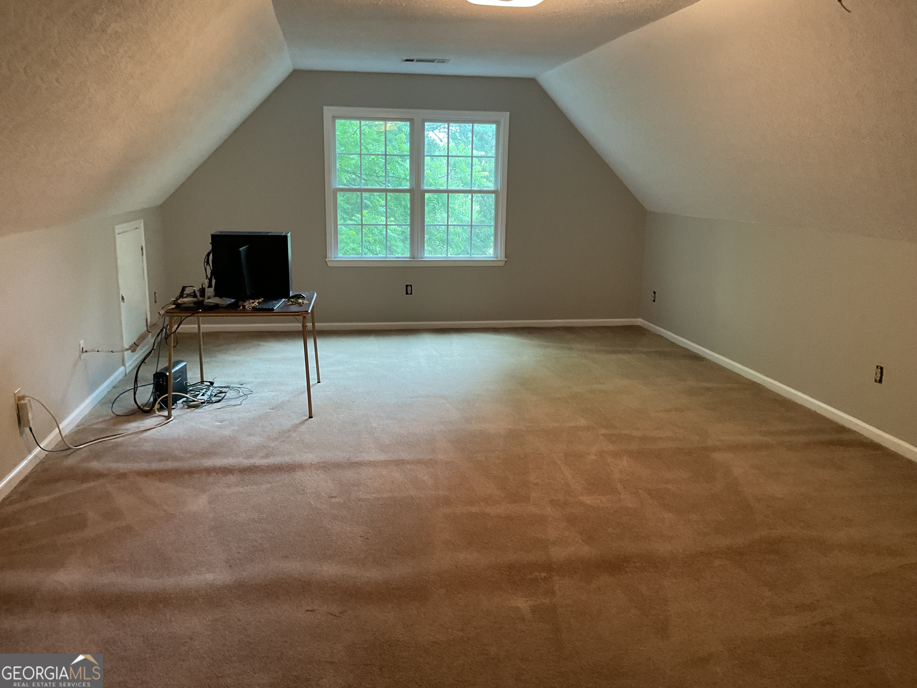 4800 Bethlehem Road Fairburn, GA 30213 - Photo 42 of 49 an empty room with windows and fireplace