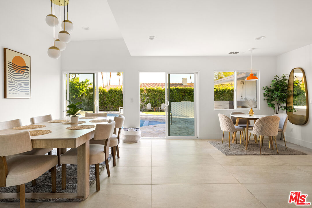 74085 Setting Sun Trail Palm Desert, CA 92260 - Photo 17 of 57 a view of a dining room with furniture window and outside view