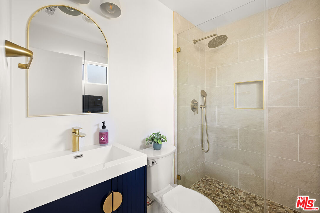 74085 Setting Sun Trail Palm Desert, CA 92260 - Photo 23 of 57 a bathroom with a sink toilet and shower