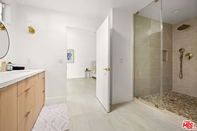 a bathroom with a sink and a shower