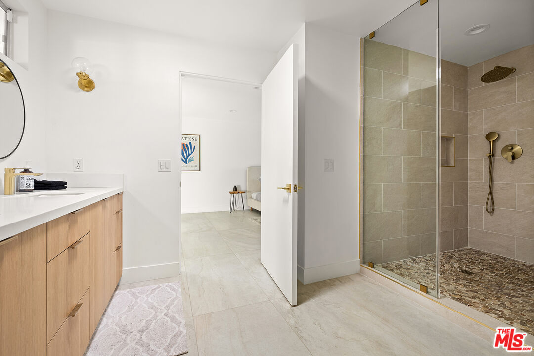 74085 Setting Sun Trail Palm Desert, CA 92260 - Photo 28 of 57 a bathroom with a sink and a mirror