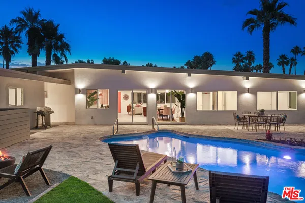 a view of a chairs and table in patio