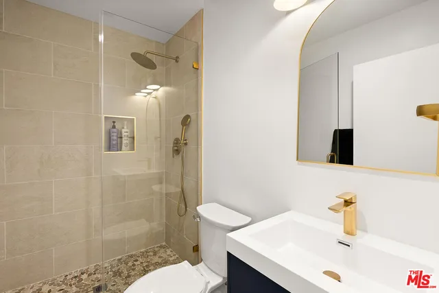 a view of a roof deck with couch and chairs