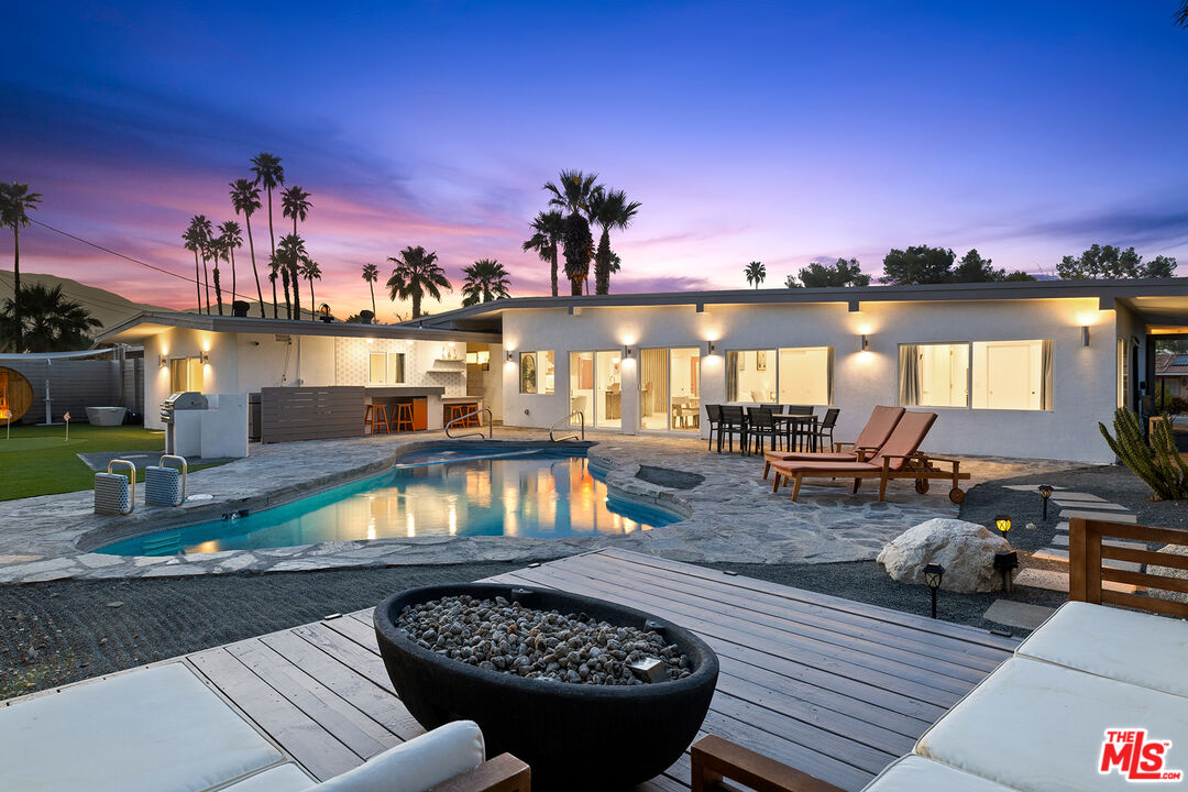 74085 Setting Sun Trail Palm Desert, CA 92260 - Photo 52 of 57 a view of a roof deck with couch and chairs