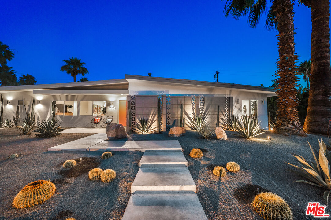 74085 Setting Sun Trail Palm Desert, CA 92260 - Photo 57 of 57 a view of a porch with furniture and floor to ceiling window