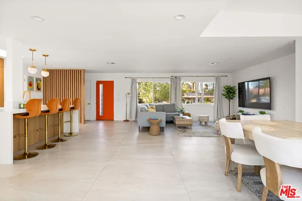 a kitchen with stainless steel appliances kitchen island granite countertop a sink and cabinets