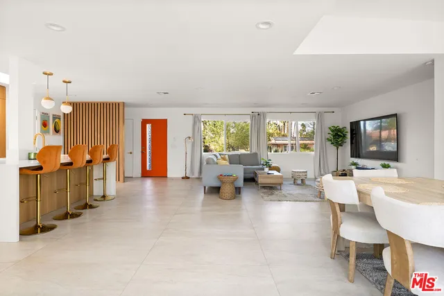 a kitchen with stainless steel appliances kitchen island granite countertop a sink and cabinets