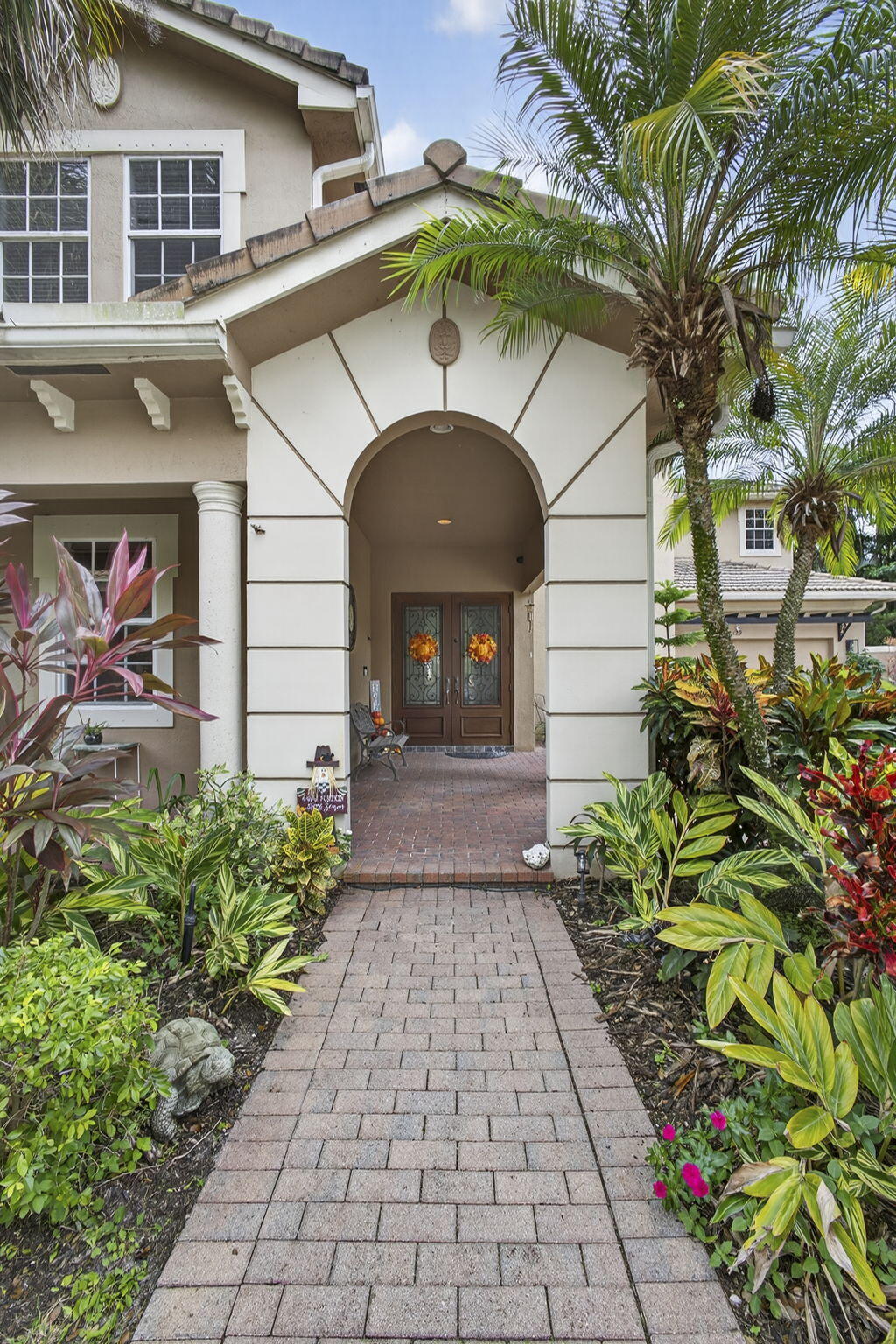 129 Via Bosque Jupiter, FL 33458 - Photo 17 of 92 a front view of a house with garden