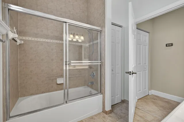 a kitchen with stainless steel appliances granite countertop a sink and a refrigerator
