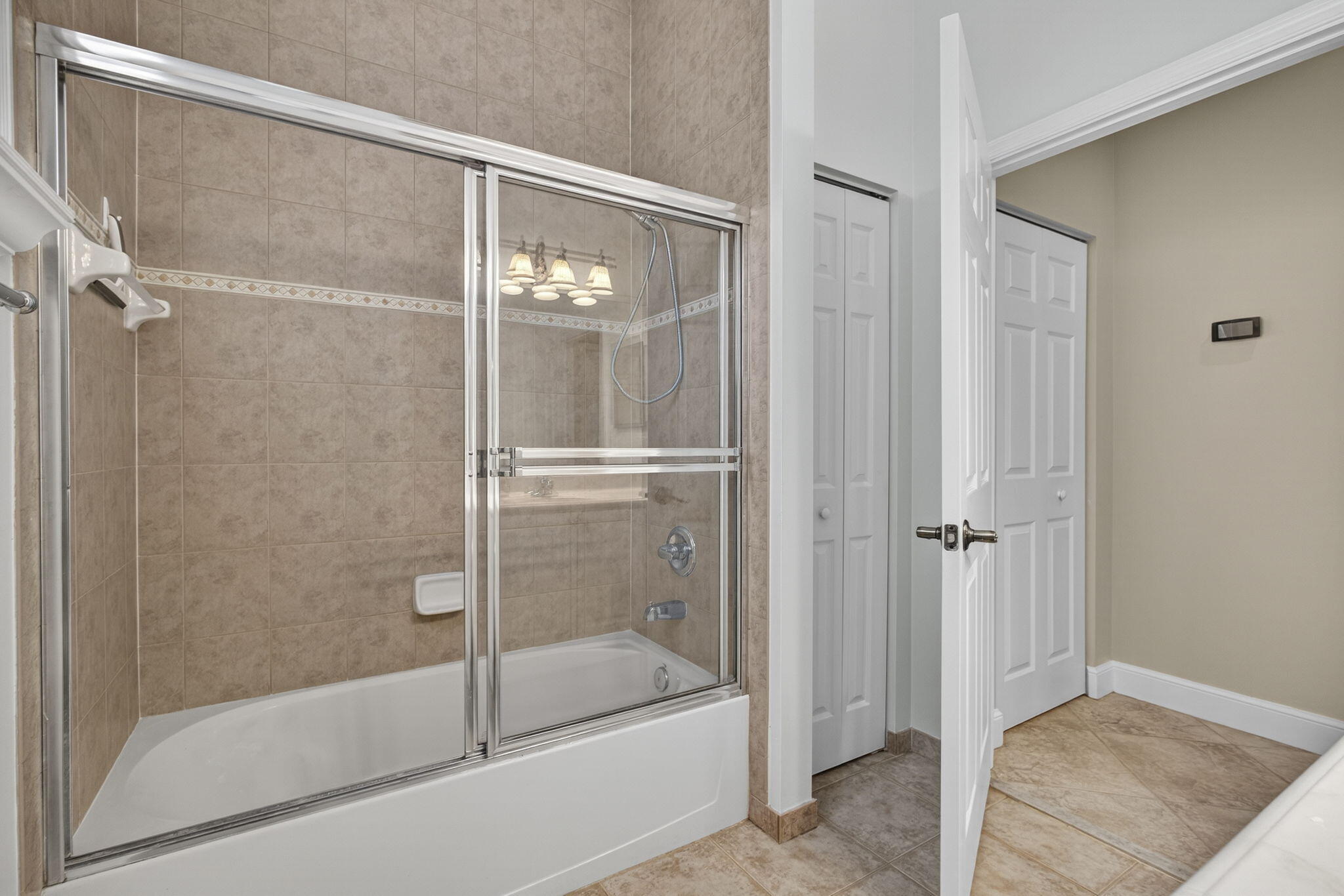 129 Via Bosque Jupiter, FL 33458 - Photo 23 of 92 a bathroom with a bathtub and a shower