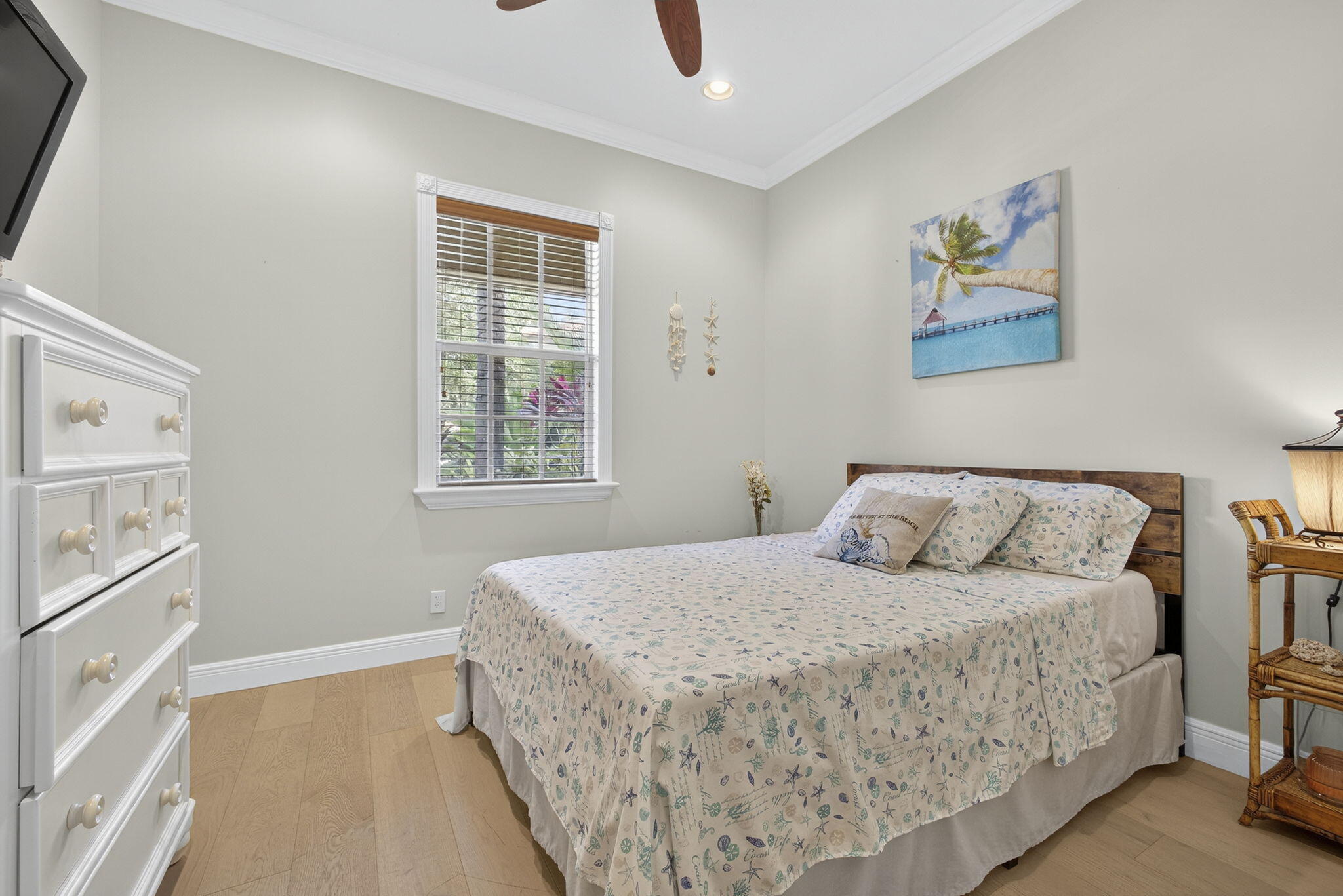 129 Via Bosque Jupiter, FL 33458 - Photo 24 of 92 a bedroom with a large bed and a window