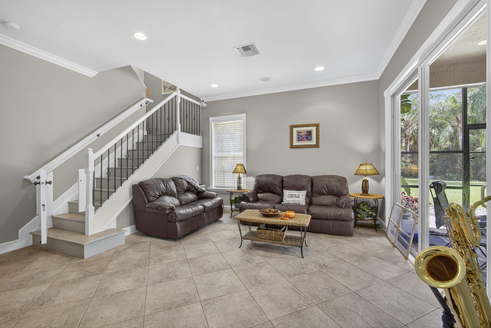 129 Via Bosque Jupiter, FL 33458 - Photo 31 of 92 a living room with furniture and a flat screen tv