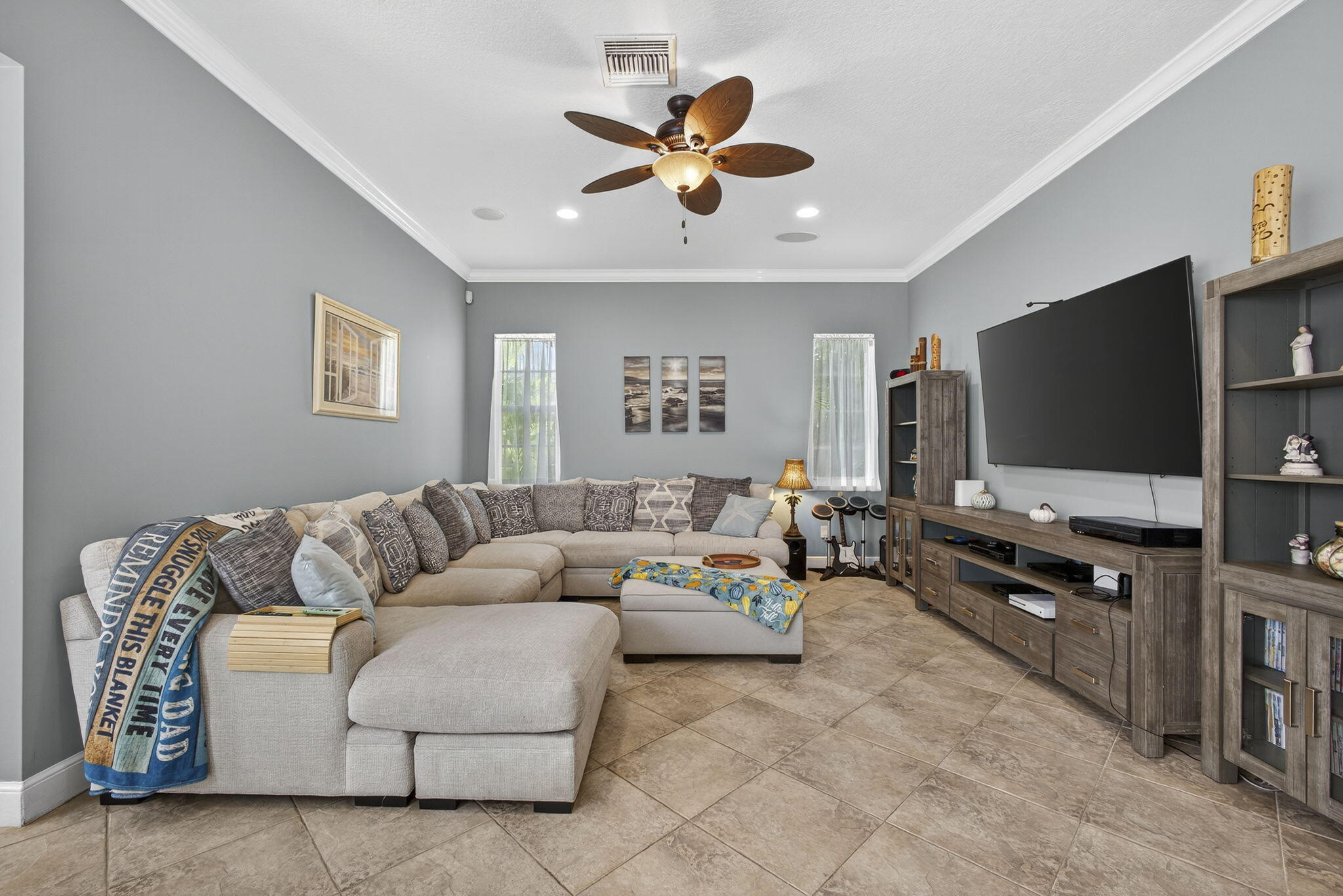 129 Via Bosque Jupiter, FL 33458 - Photo 43 of 92 a living room with furniture and a flat screen tv