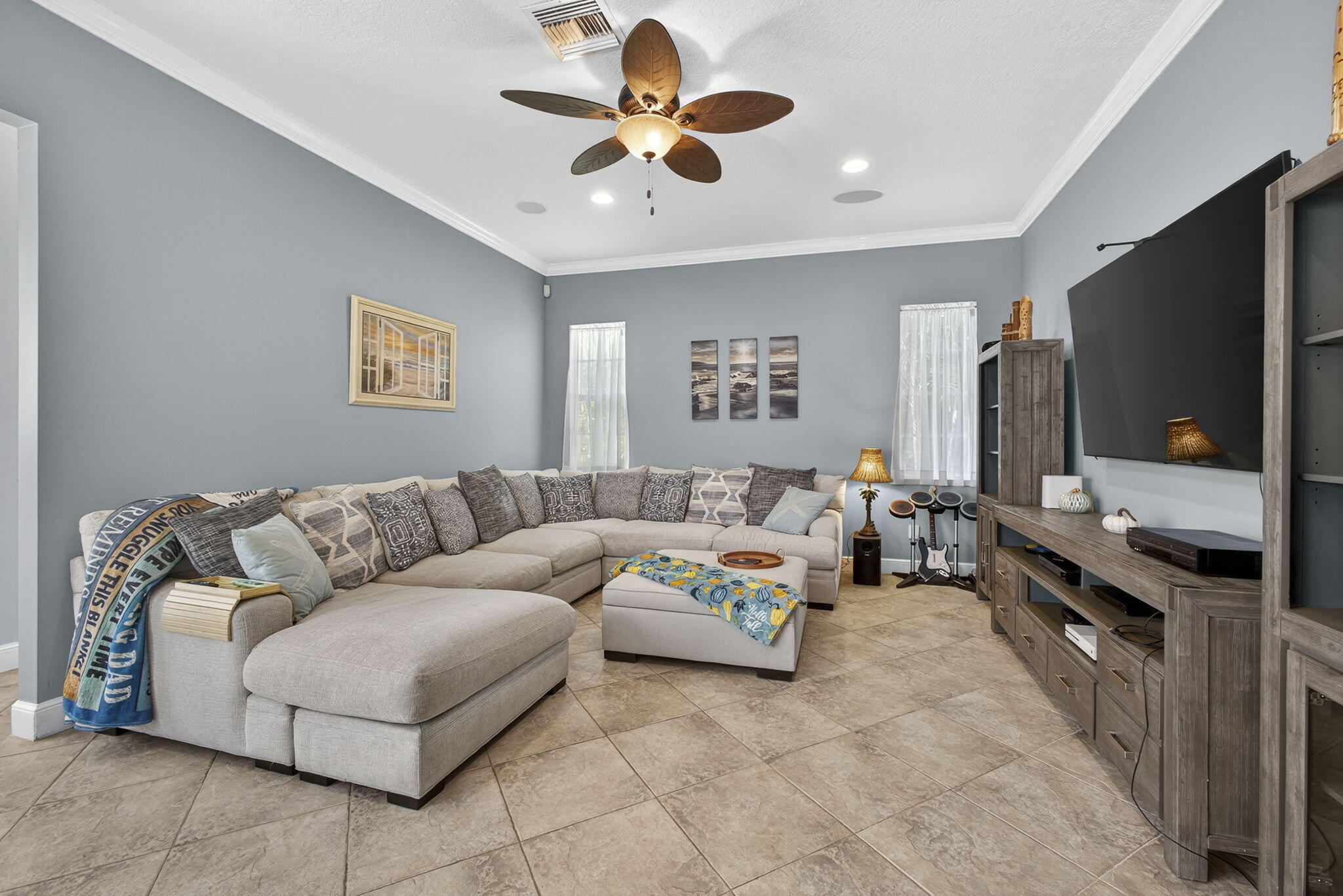 129 Via Bosque Jupiter, FL 33458 - Photo 44 of 92 a living room with furniture and a flat screen tv