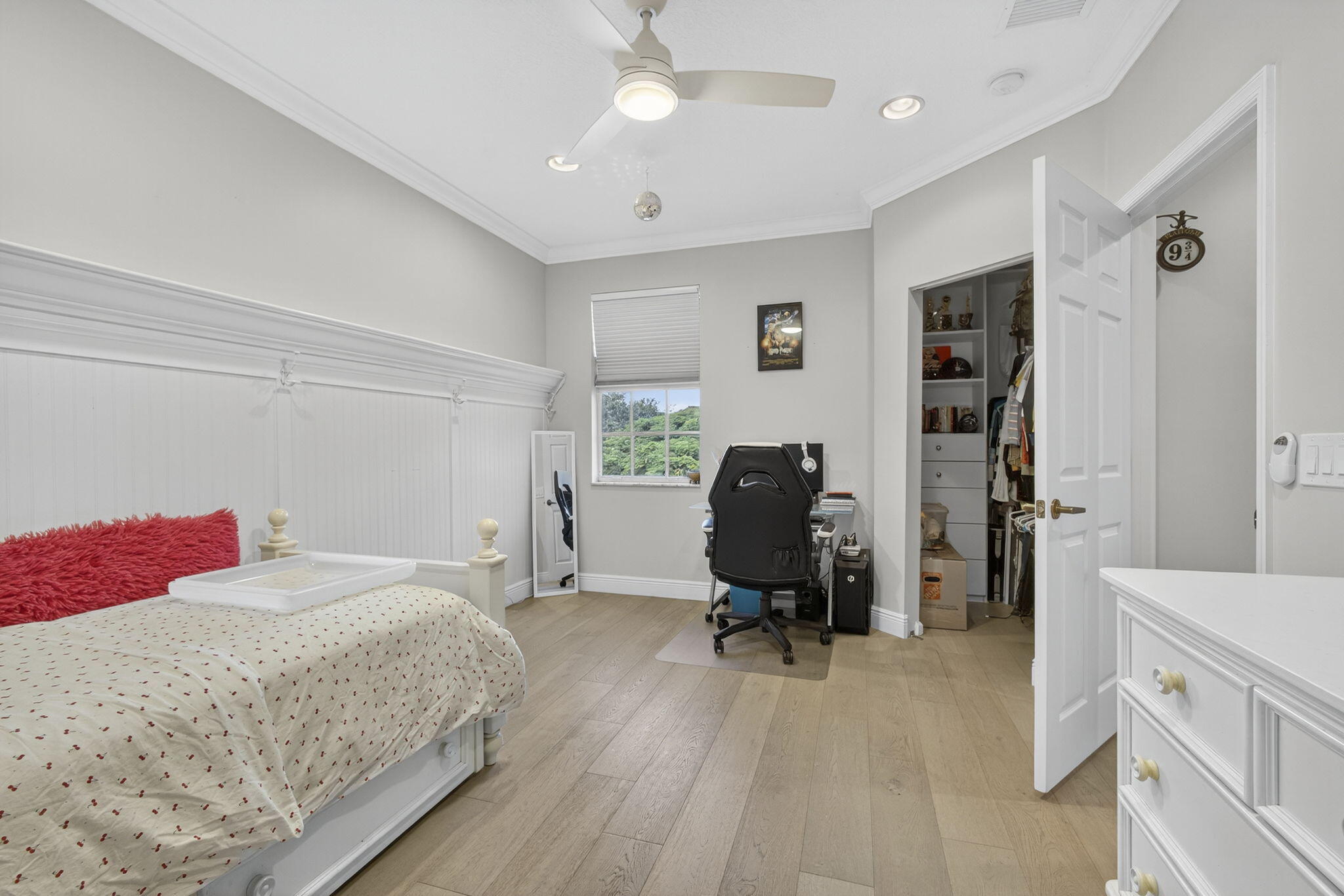 129 Via Bosque Jupiter, FL 33458 - Photo 49 of 92 a bedroom with a bed and a chandelier