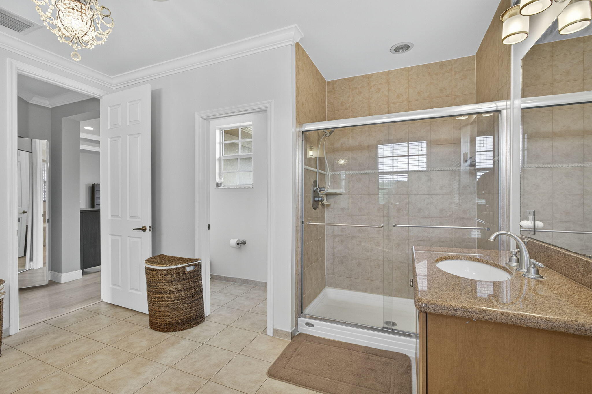 129 Via Bosque Jupiter, FL 33458 - Photo 66 of 92 a bathroom with a granite countertop sink a toilet a mirror and shower